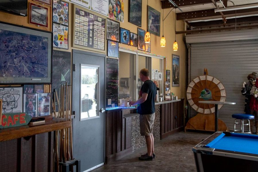 Man enjoying the Hillz Kitchen Cafe at Skydive City