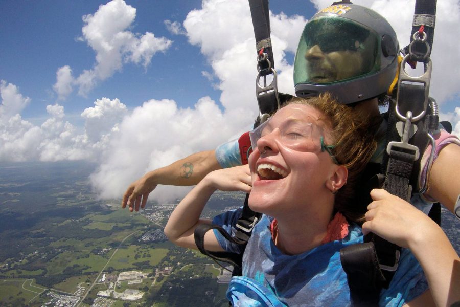 Female tandem skydiver enjoying being under canopy with Skydive City tandem instructor.