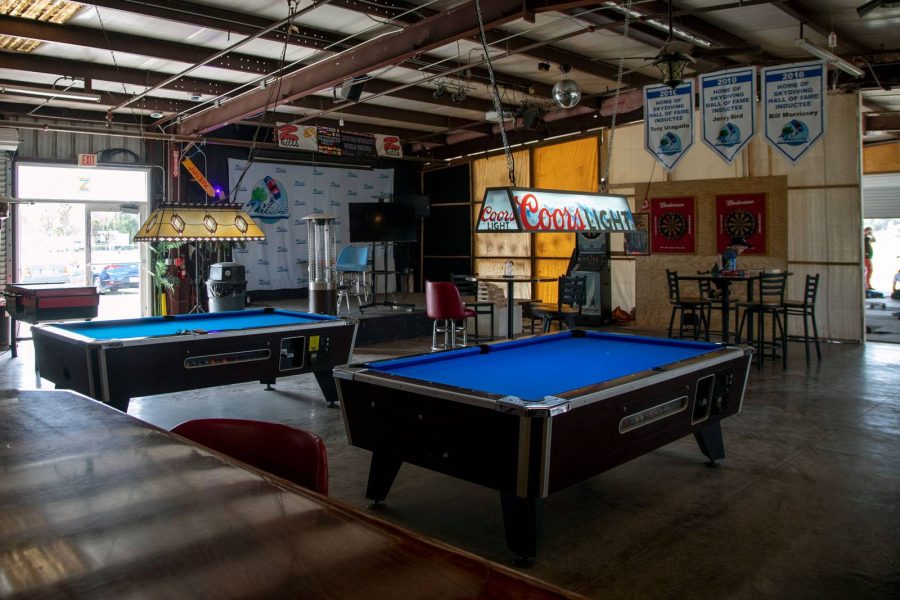 Blue pool tables inside of the Birdhouse Entertainment Center at Skydive City.