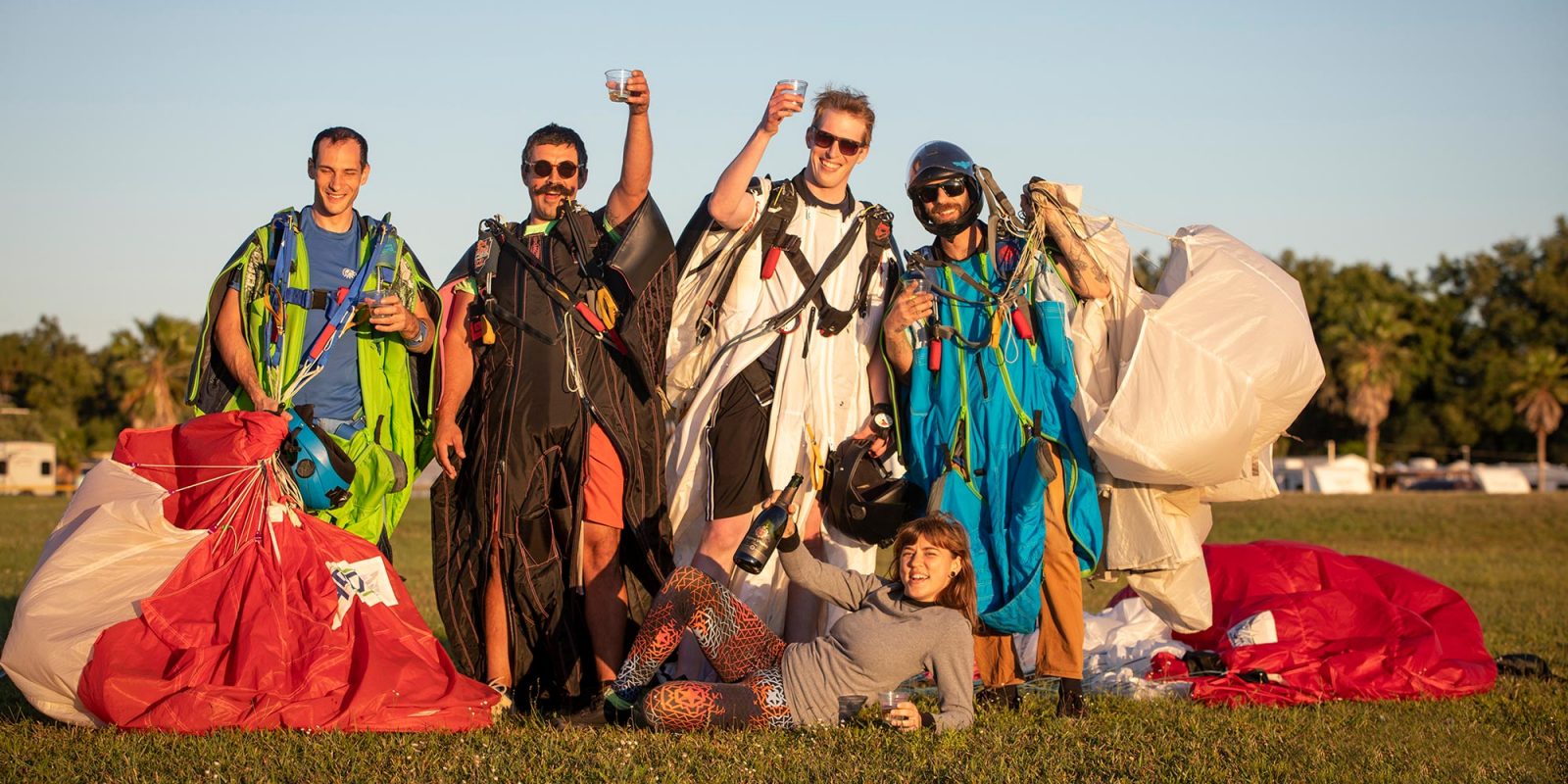 Skydivers celebrating with champagne after a fun jump at Skydive City Z-Hills.