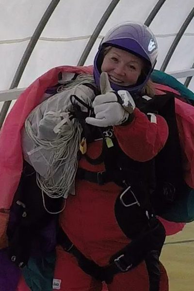 Audra Gonzalez giving a thumbs up while holding on to canopy.