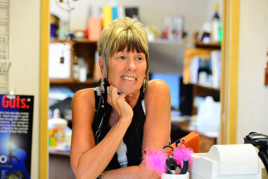 Joannie Murphy standing at cash register