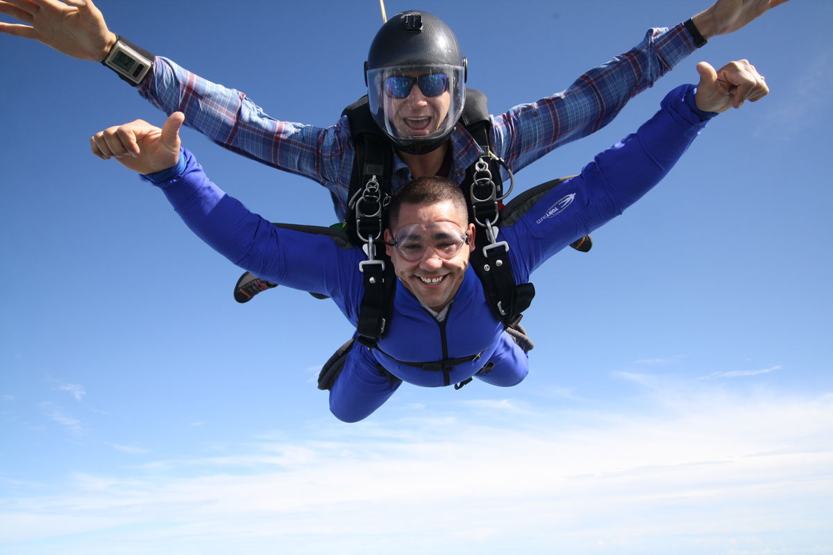 Tandem skydiver enjoying free fall at Skydive City