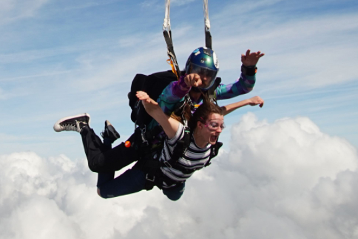 Tandem instructor and student enjoying freefall while skydiving at Skydive City